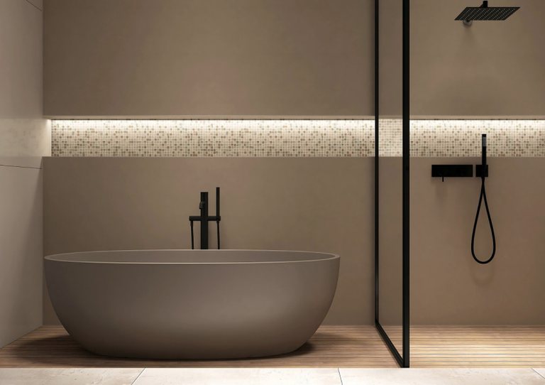 Phòng tắm có dải hắt sáng gián tiếp chạy ngang tường, bồn tắm độc lập và vách kính khung đen